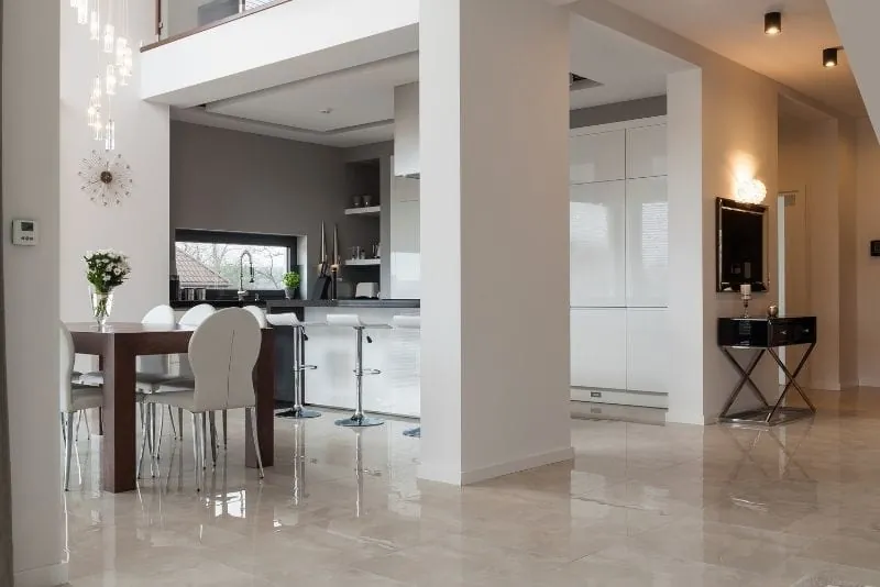 Modern open-plan living space with a glossy epoxy-look floor