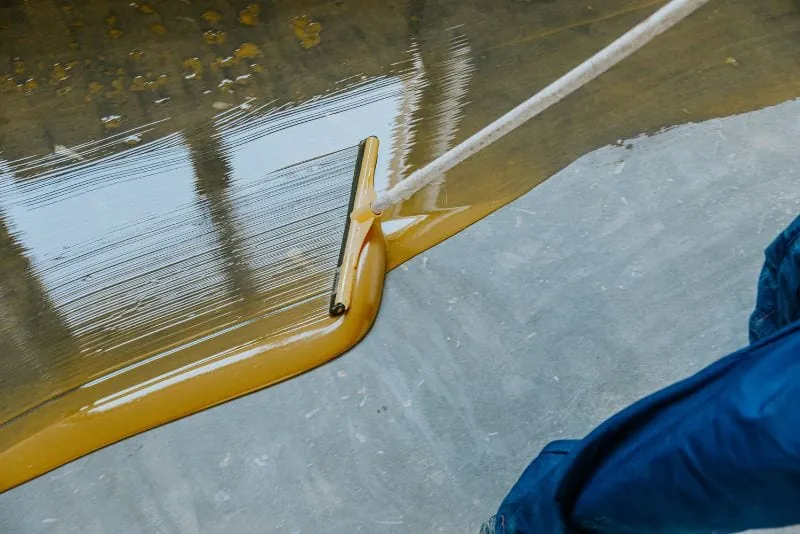 Levelling a clear epoxy coating across a garage floor