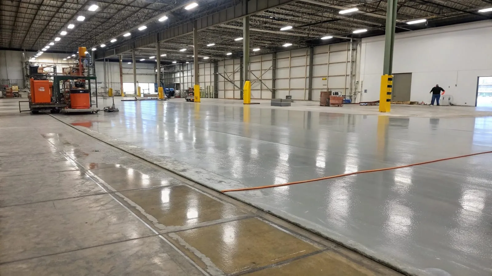 Concrete overlay and topping application on an industrial warehouse floor during a Port Kembla restoration project