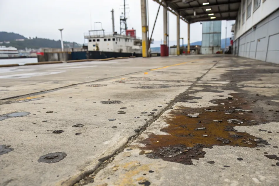 Concrete floor showing various contamination issues before surface preparation