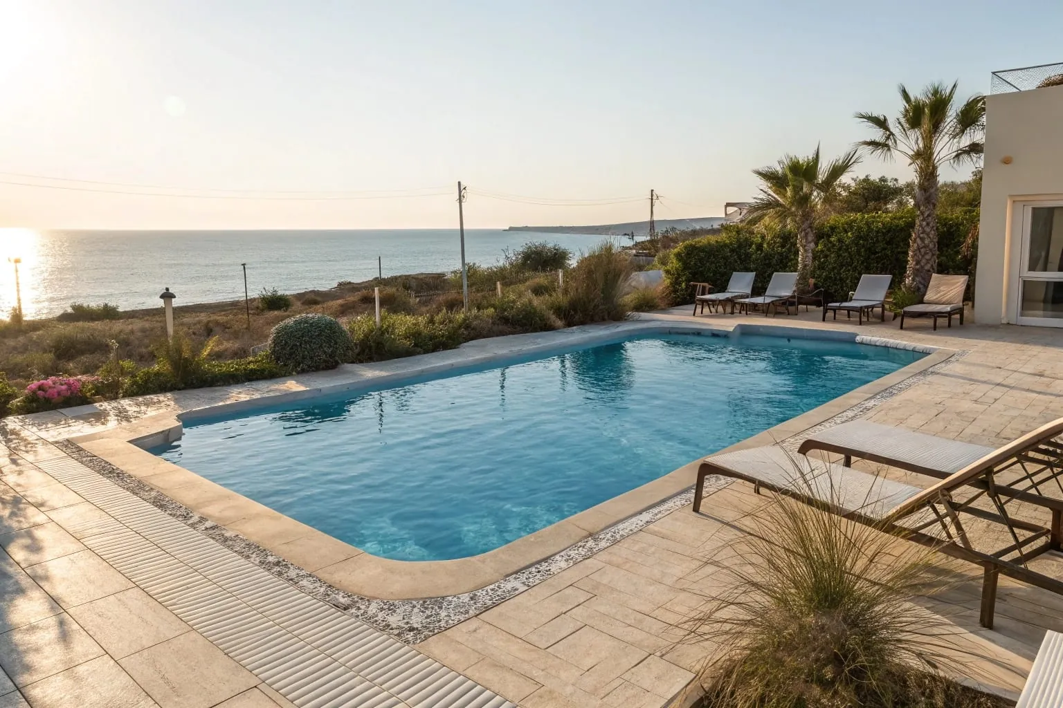 Modern pool deck epoxy coating around residential swimming pool