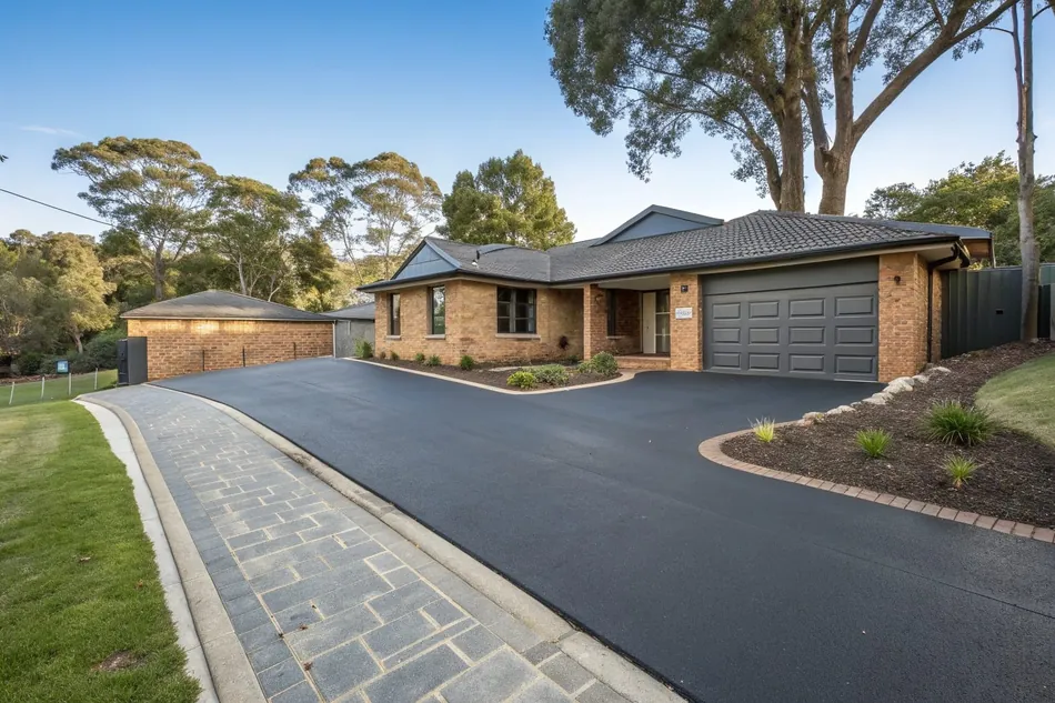 Epoxy coated driveway renovation at a 1980s home