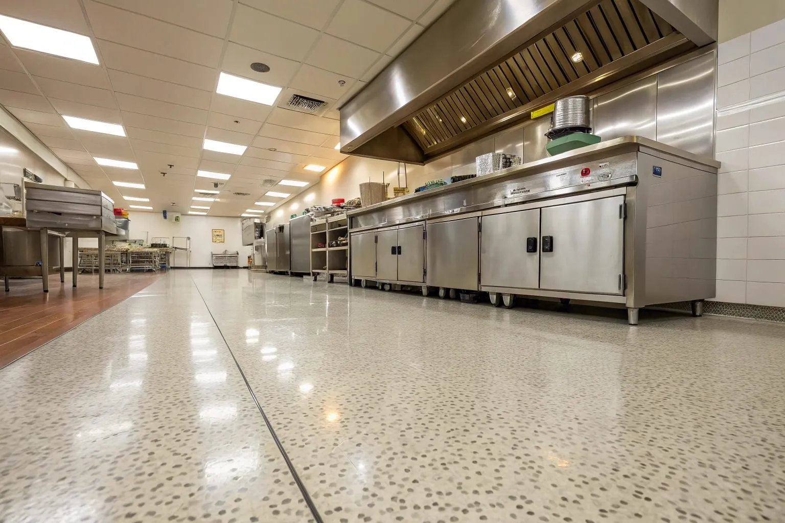 Commercial kitchen floor with slip-resistant coating treatment in a restaurant